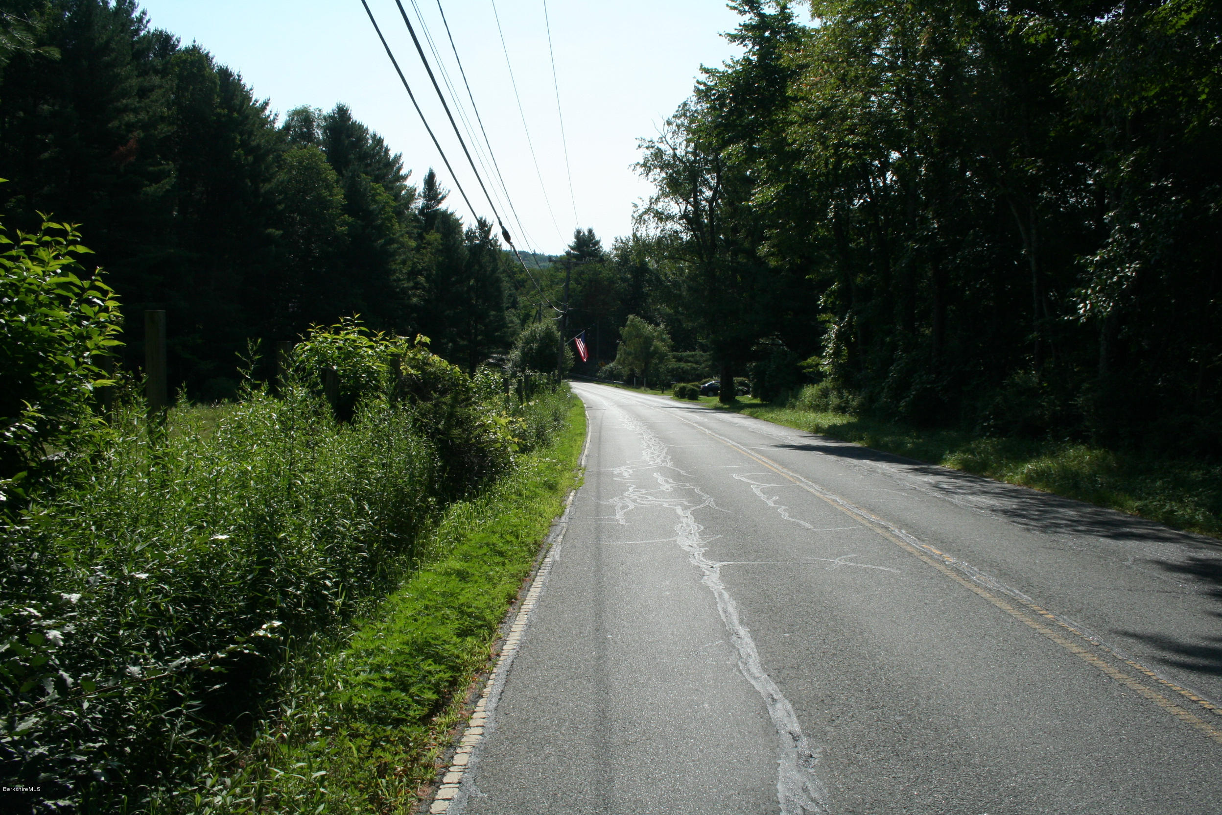 22 Sandisfield Road Sandisfield, MA 01255 - Photo 3 of 27 a view of a street with a trees in the background