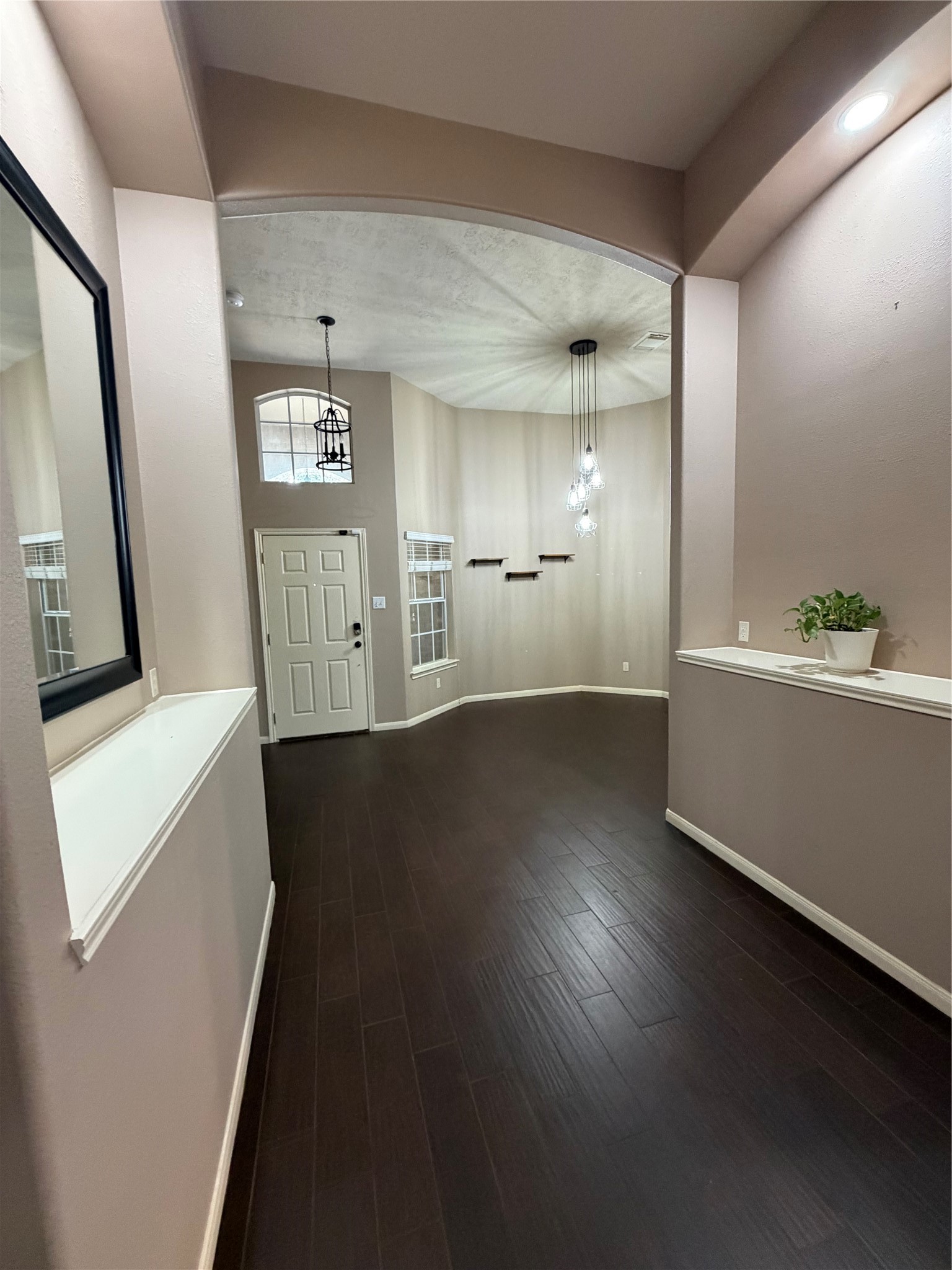 903 Cascade Ridge Katy, TX 77494 - Photo 4 of 24 a view of an empty room with wooden floor and a window