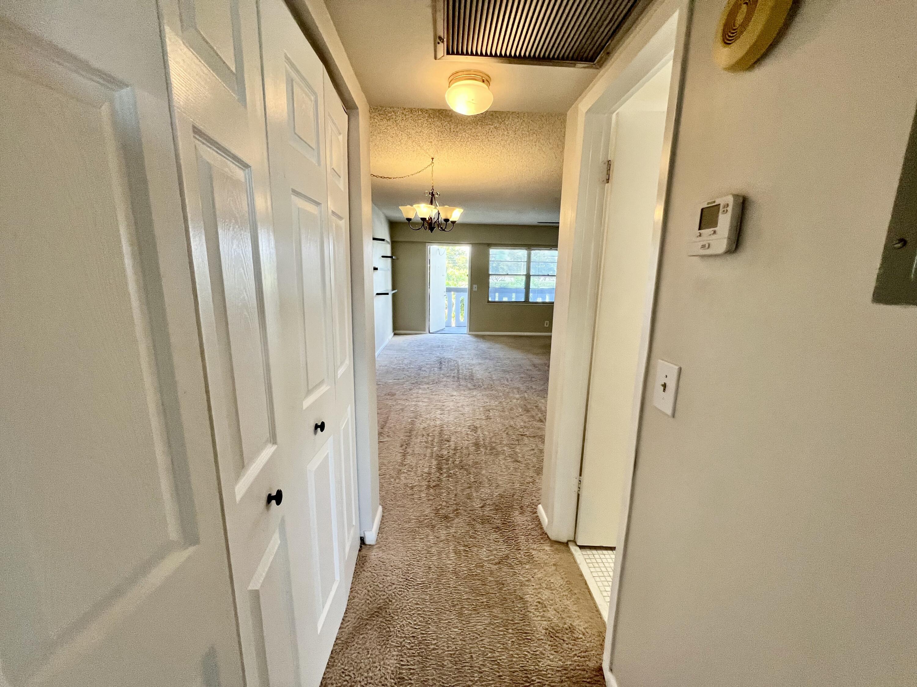 209 Suffolk F Boca Raton, FL 33434 - Photo 24 of 25 Hallway with Closet