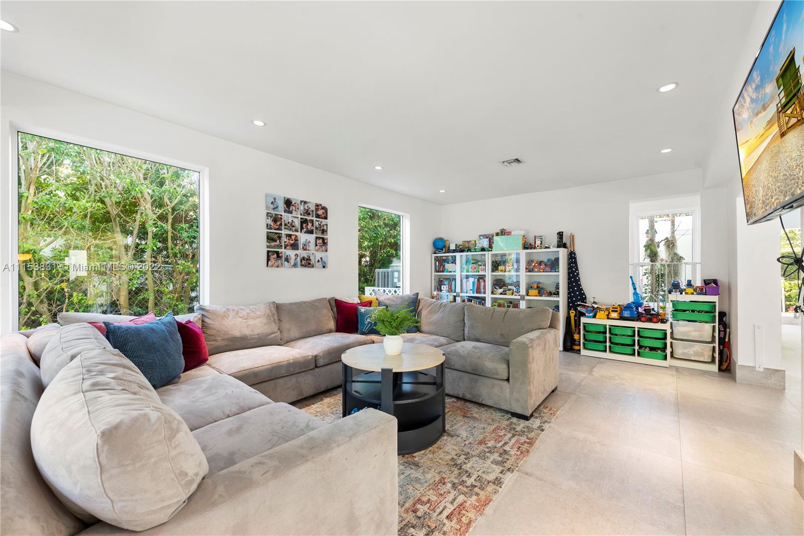 260 Ridgewood Road Key Biscayne, FL 33149 - Photo 13 of 41 a living room with furniture and a large window