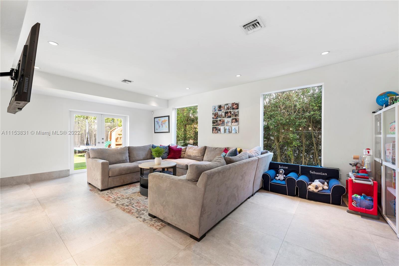 260 Ridgewood Road Key Biscayne, FL 33149 - Photo 14 of 41 a living room with furniture and a window