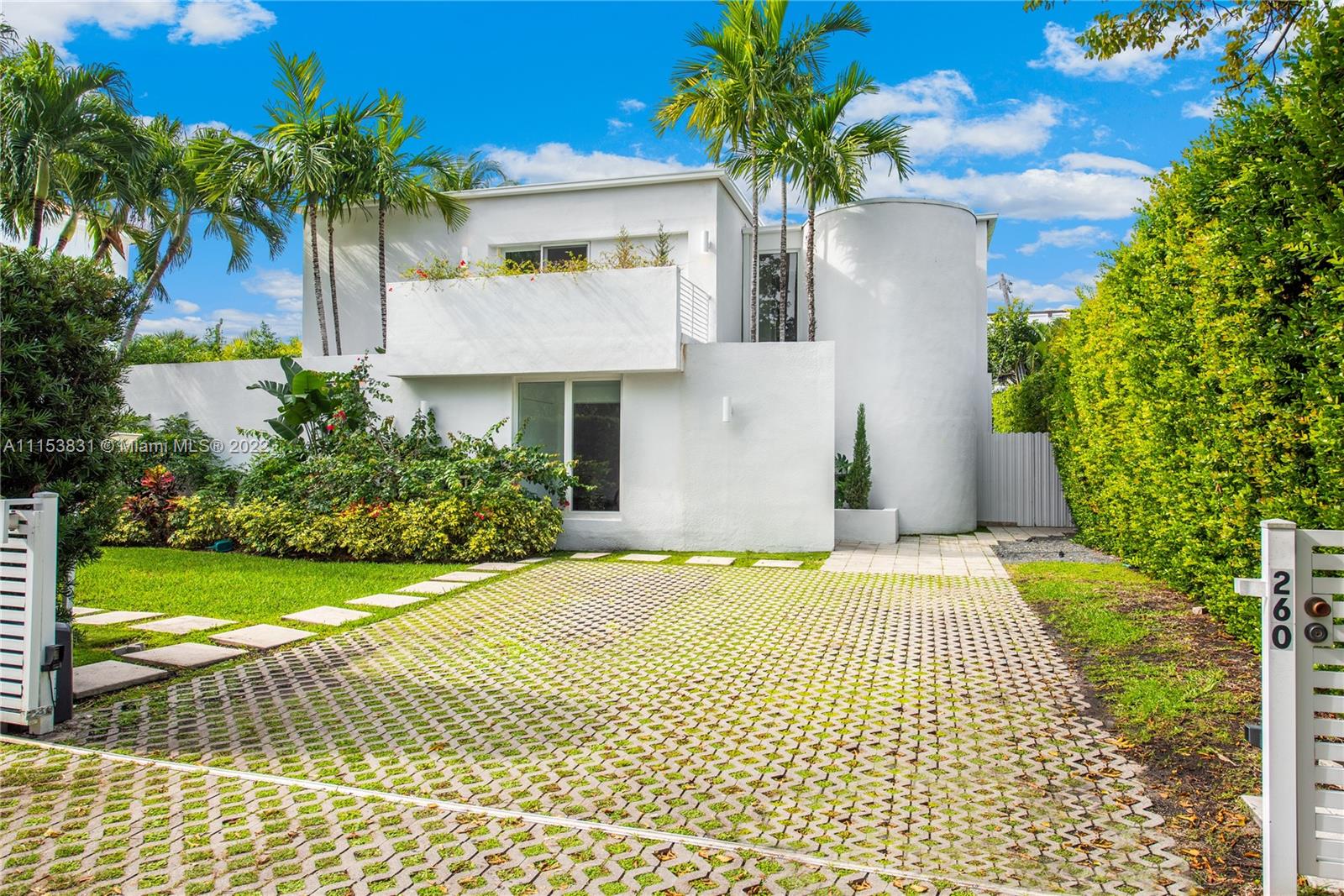 260 Ridgewood Road Key Biscayne, FL 33149 - Photo 2 of 41 a house view with a garden space