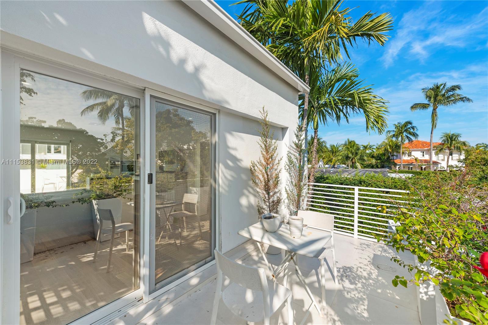 260 Ridgewood Road Key Biscayne, FL 33149 - Photo 22 of 41 a view of a balcony with potted plants