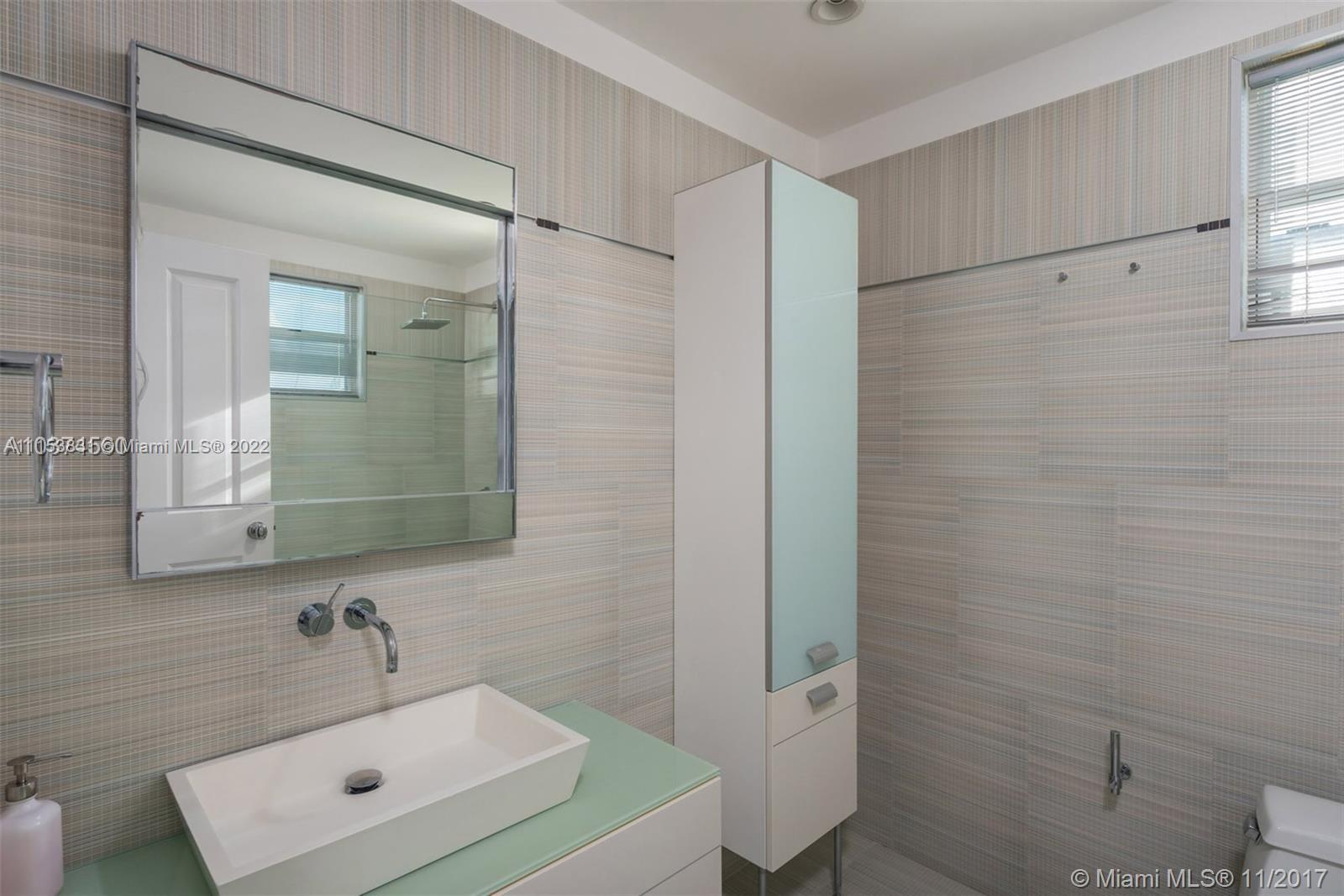 260 Ridgewood Road Key Biscayne, FL 33149 - Photo 26 of 41 a bathroom with a sink a toilet and shower