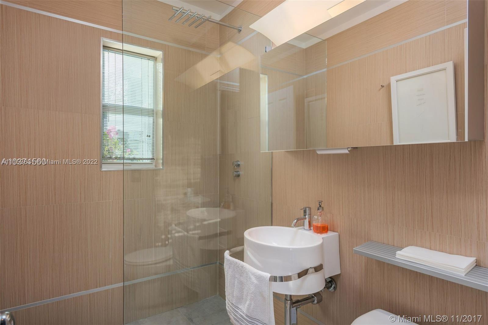 260 Ridgewood Road Key Biscayne, FL 33149 - Photo 29 of 41 a bathroom with a sink a toilet and shower