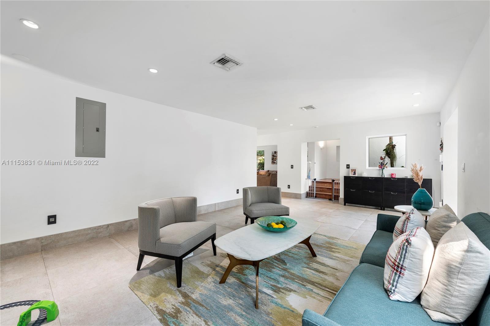 260 Ridgewood Road Key Biscayne, FL 33149 - Photo 3 of 41 a living room with furniture and wooden floor