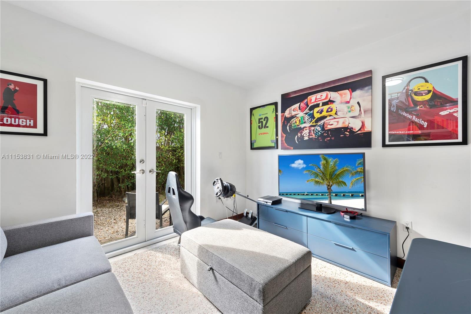 260 Ridgewood Road Key Biscayne, FL 33149 - Photo 31 of 41 a living room with furniture and a flat screen tv