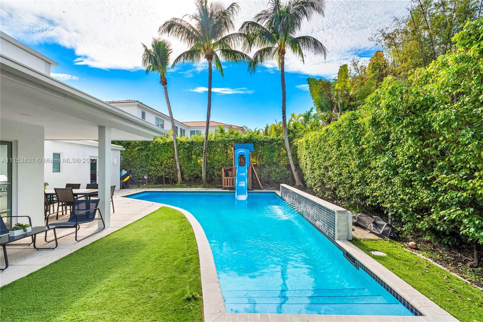 260 Ridgewood Road Key Biscayne, FL 33149 - Photo 33 of 41 a view of a backyard with swimming pool