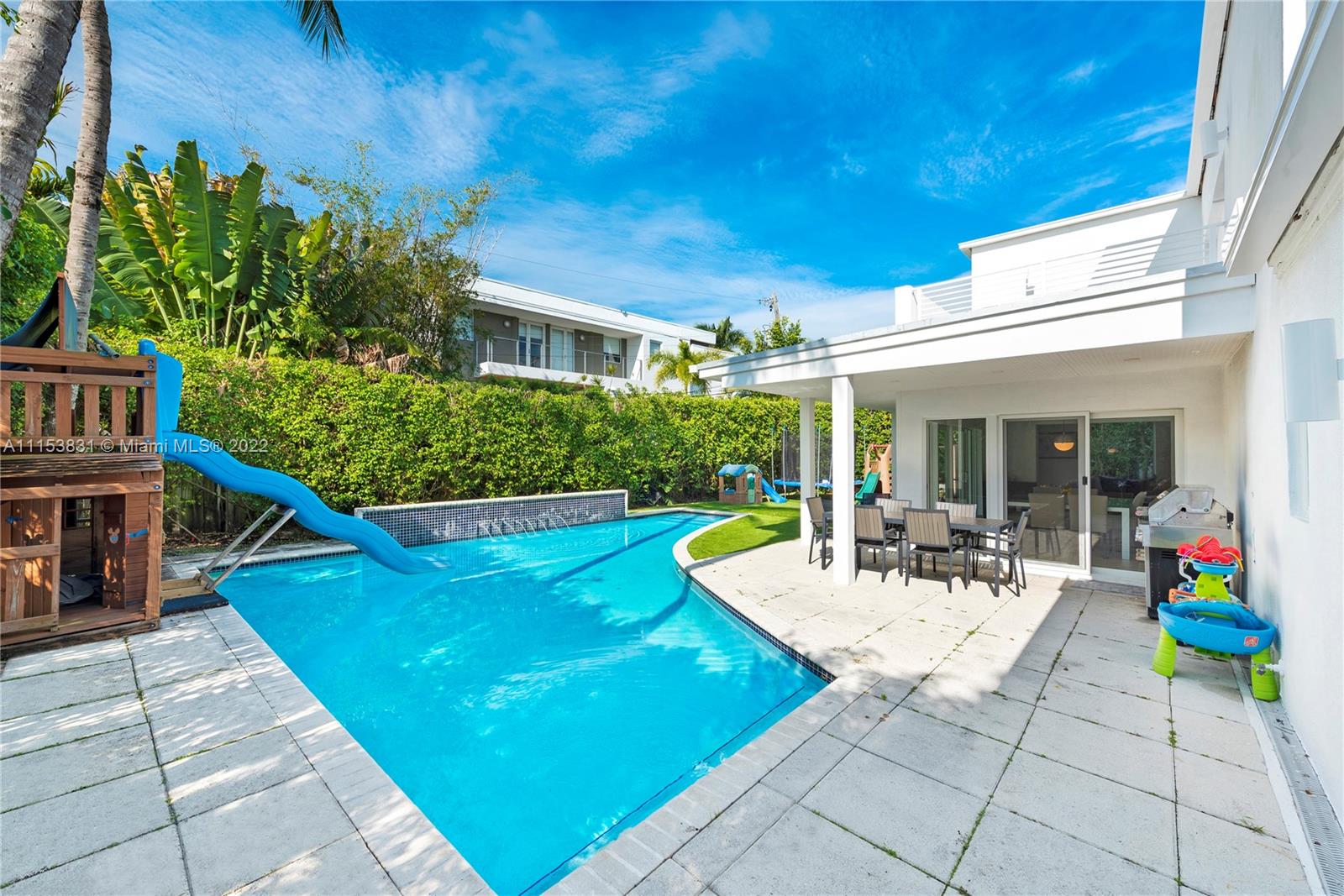 260 Ridgewood Road Key Biscayne, FL 33149 - Photo 35 of 41 a view of a house with swimming pool and sitting area