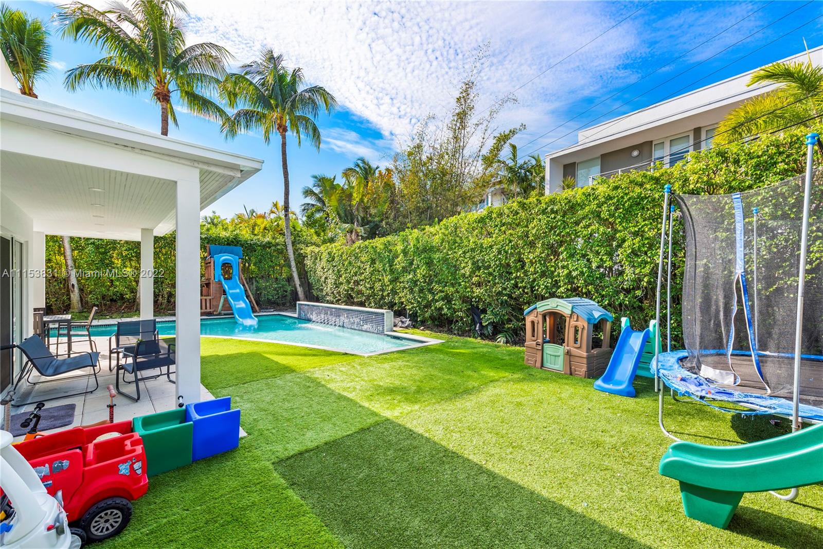 260 Ridgewood Road Key Biscayne, FL 33149 - Photo 36 of 41 a swimming pool with outdoor seating and yard