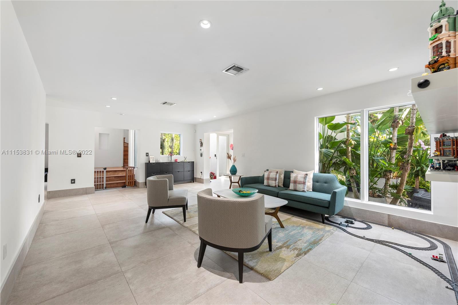 260 Ridgewood Road Key Biscayne, FL 33149 - Photo 4 of 41 a living room with furniture and a large window