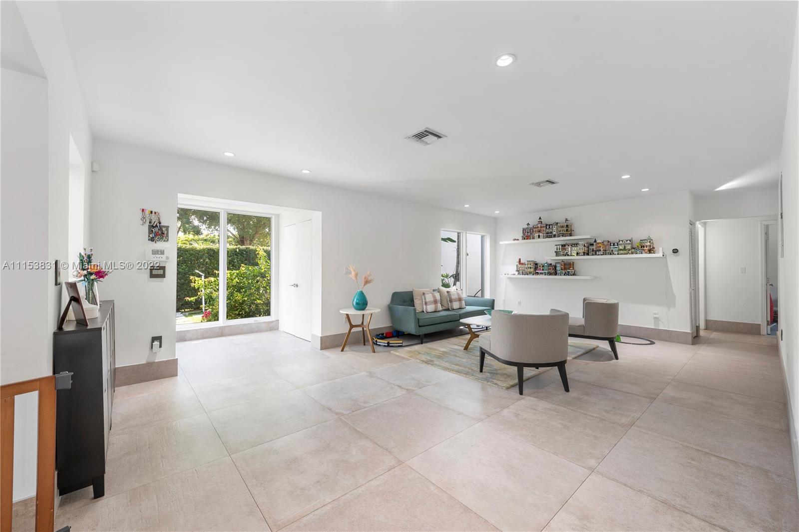 260 Ridgewood Road Key Biscayne, FL 33149 - Photo 5 of 41 a living room with furniture and a window