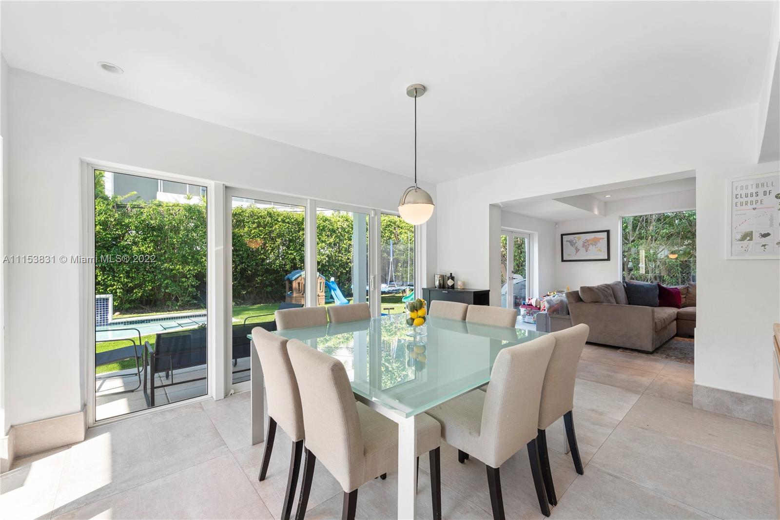 260 Ridgewood Road Key Biscayne, FL 33149 - Photo 8 of 41 a view of a dining room with furniture window and outside view