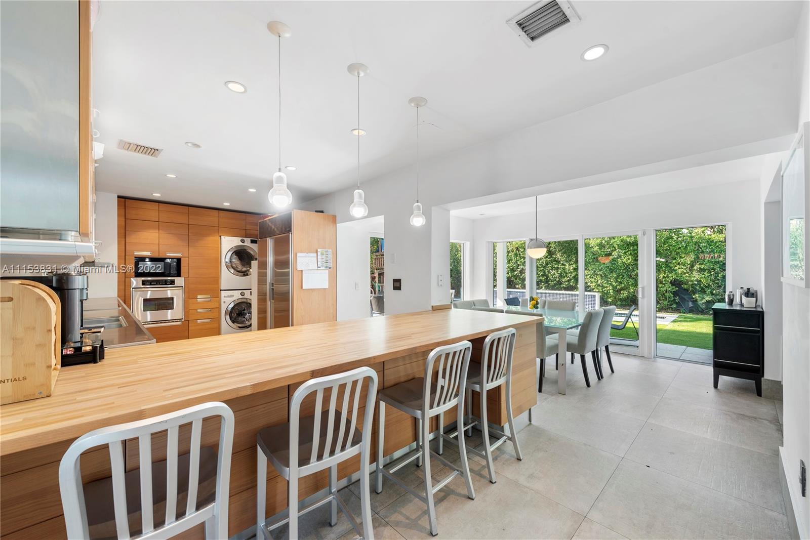 260 Ridgewood Road Key Biscayne, FL 33149 - Photo 9 of 41 a view of a dining room with furniture window and outside view
