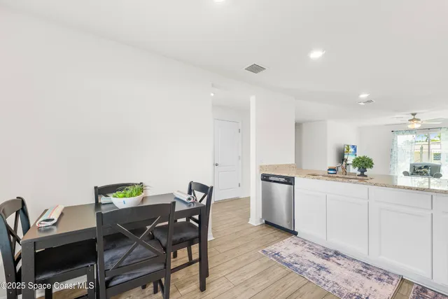 a kitchen with a table and chairs in it