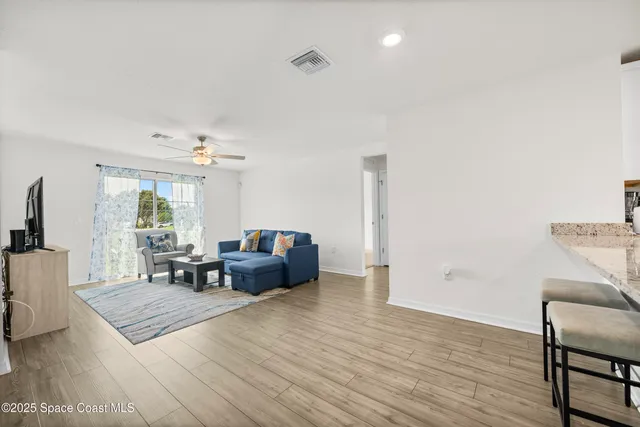 a living room with furniture and a table