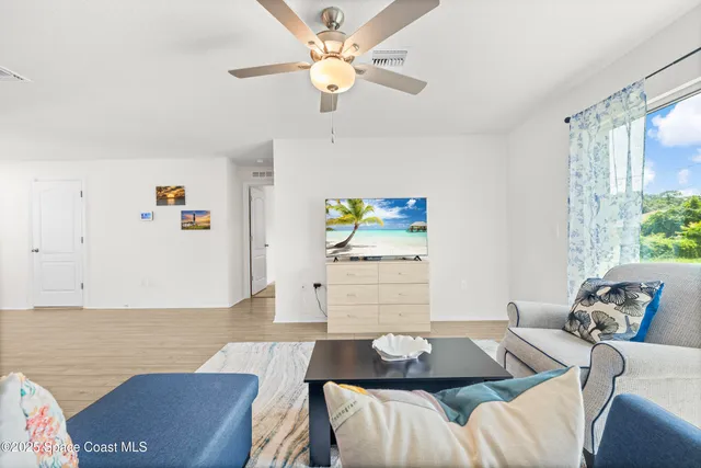 a living room with furniture and a table