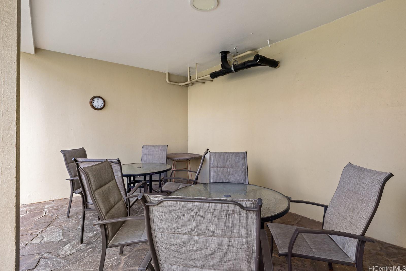 620 McCully Street, Unit 703 Honolulu, HI 96826 - Photo 20 of 25 Seating area near the pool.