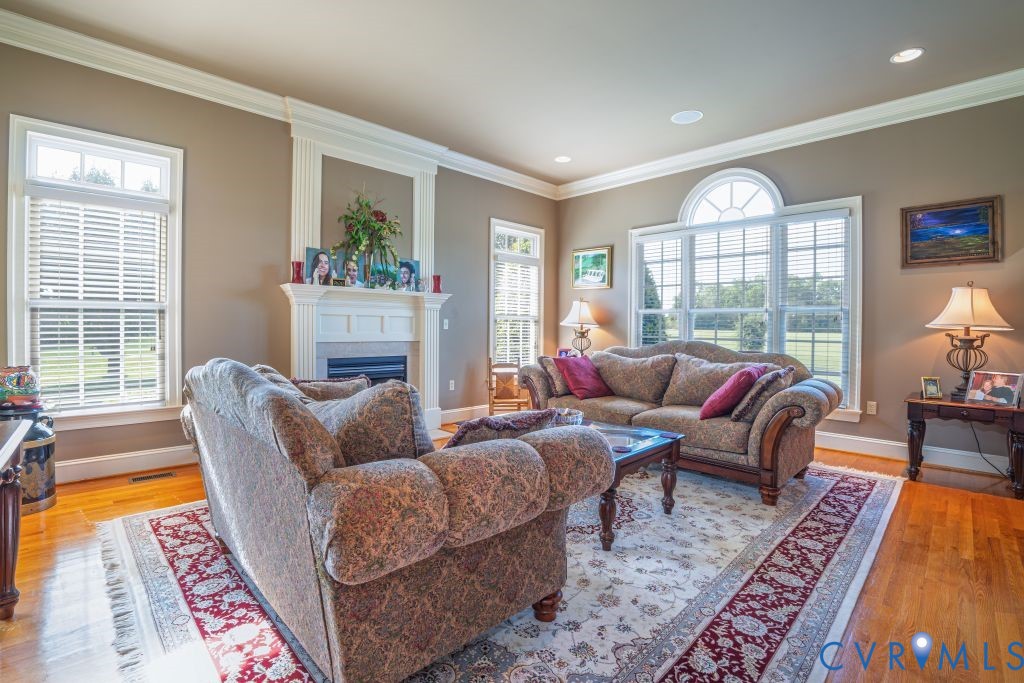 14319 Blunts Bridge Road Ashland, VA 23005 - Photo 11 of 50 Formal living room with hardwood flooring, gas fir