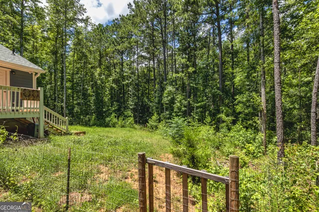a view of a house with a tree
