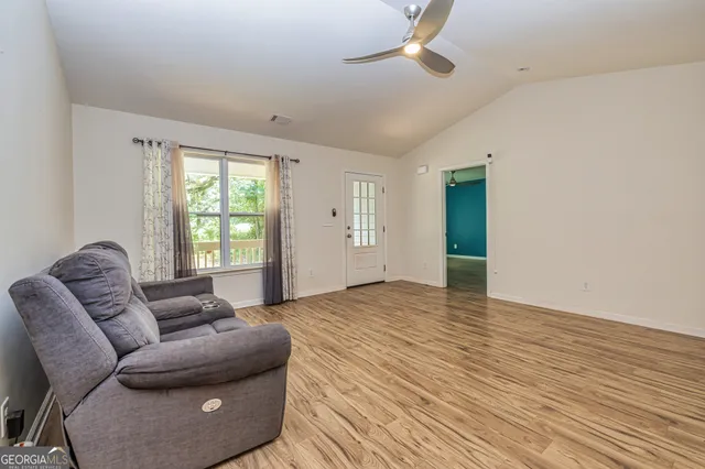 a living room with furniture and a window