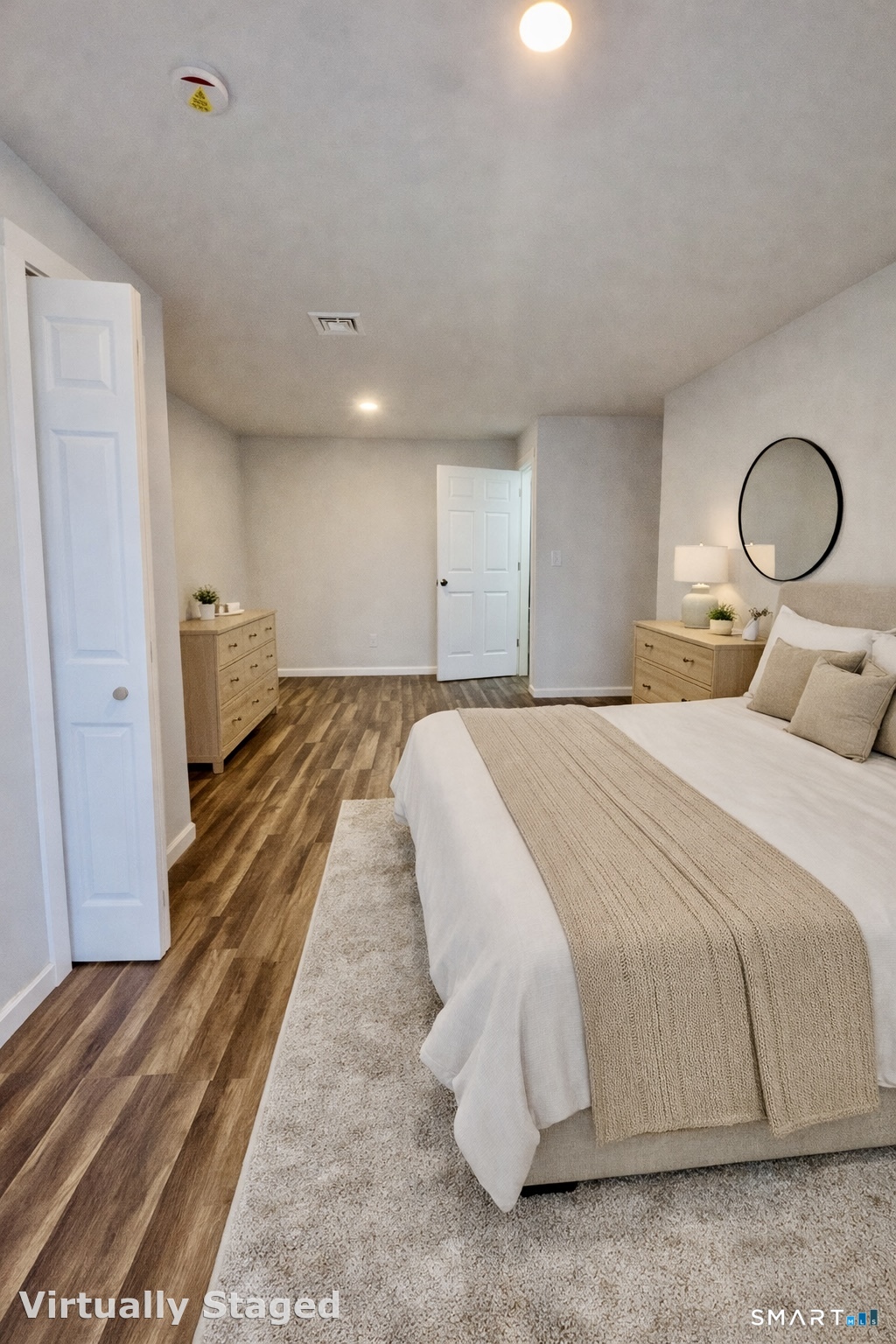 1415 Stratford Avenue Bridgeport, CT 06607 - Photo 12 of 14 a spacious bedroom with a bed and window