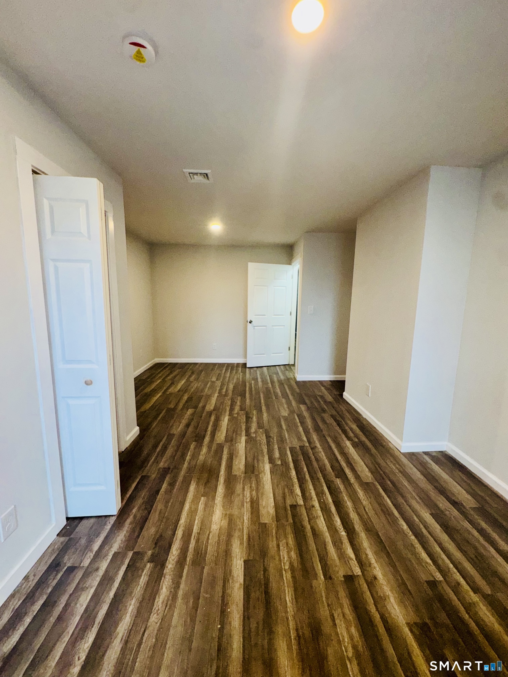 1415 Stratford Avenue Bridgeport, CT 06607 - Photo 13 of 14 a view of a room with wooden floor
