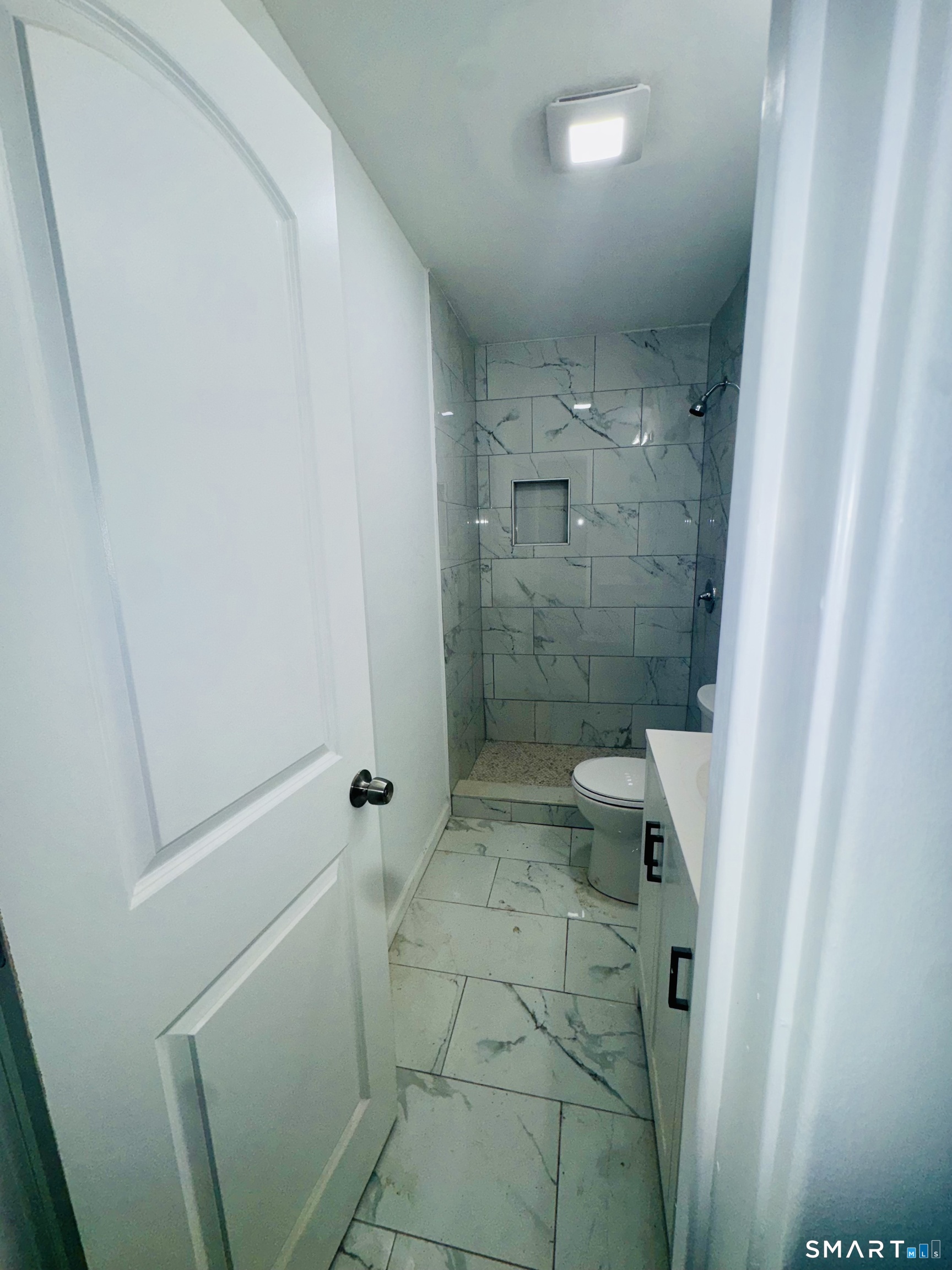 1415 Stratford Avenue Bridgeport, CT 06607 - Photo 5 of 14 a bathroom with a sink and shower