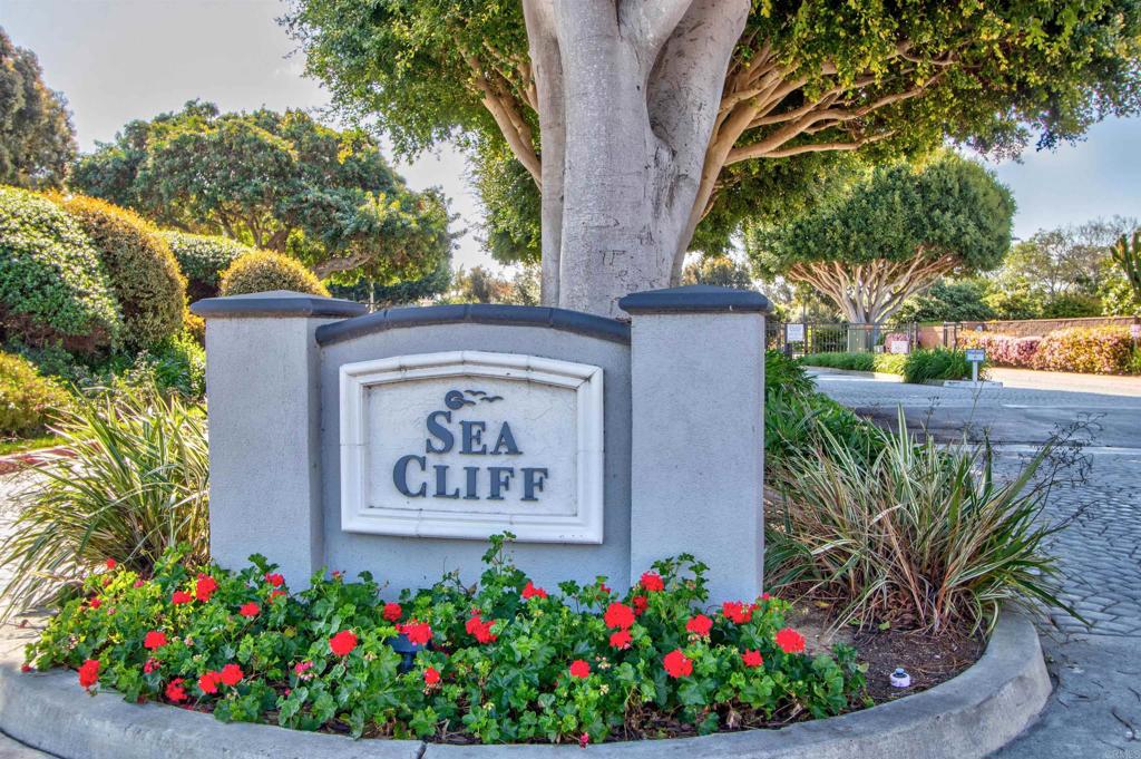 855 Lavender Way Carlsbad, CA 92011 - Photo 15 of 23 a view of sign board with flower in front of house