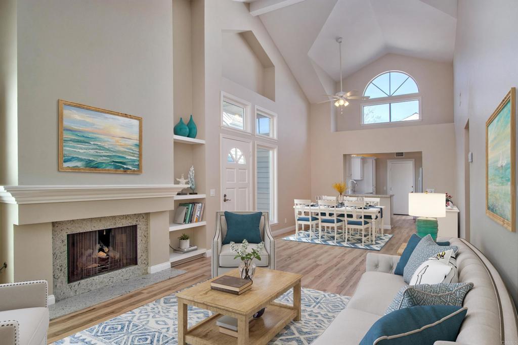 855 Lavender Way Carlsbad, CA 92011 - Photo 2 of 23 a living room with furniture a large window and a fireplace