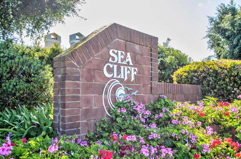 855 Lavender Way Carlsbad, CA 92011 - Photo 22 of 23 a sign that is in front of flowers