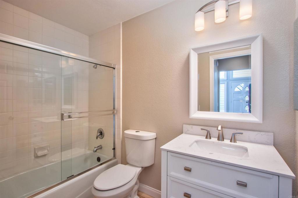 855 Lavender Way Carlsbad, CA 92011 - Photo 8 of 23 a bathroom with a sink a toilet and shower