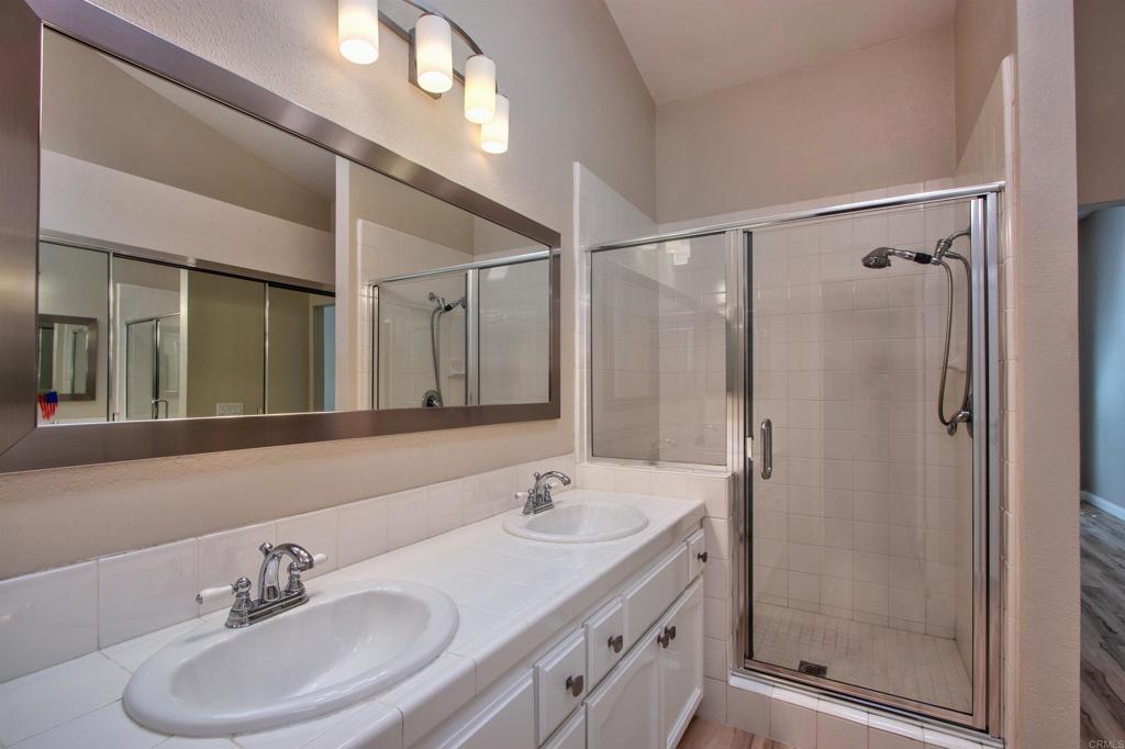 855 Lavender Way Carlsbad, CA 92011 - Photo 10 of 23 a bathroom with a sink double vanity and a mirror