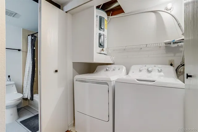 a utility room with dryer and washer