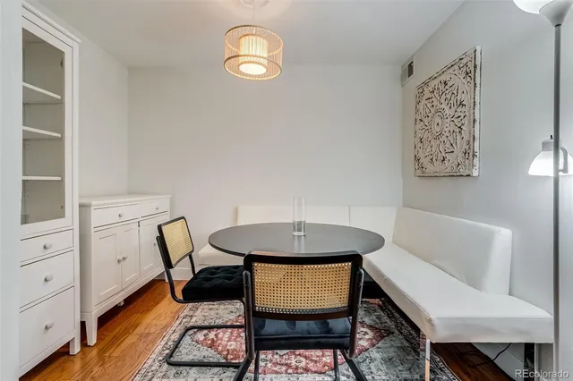 a view of a room with furniture and wooden floor
