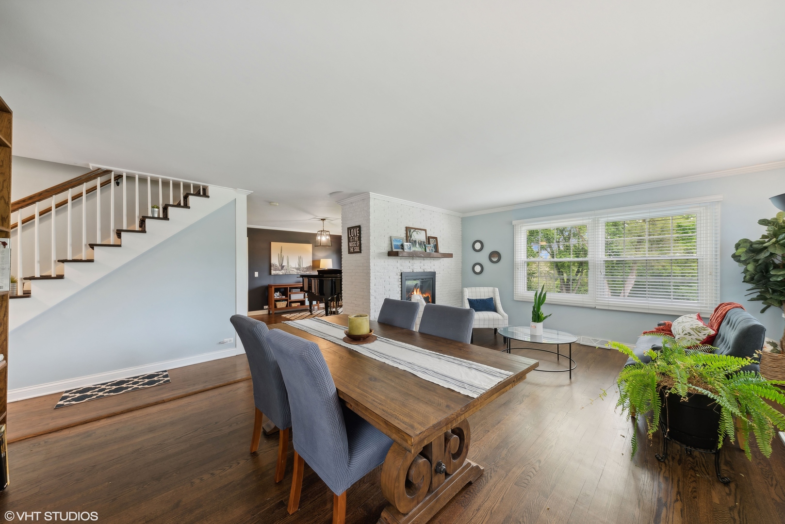 224 Orchard Road North Barrington, IL 60010 - Photo 6 of 34 a dining room with furniture potted plants and wooden floor