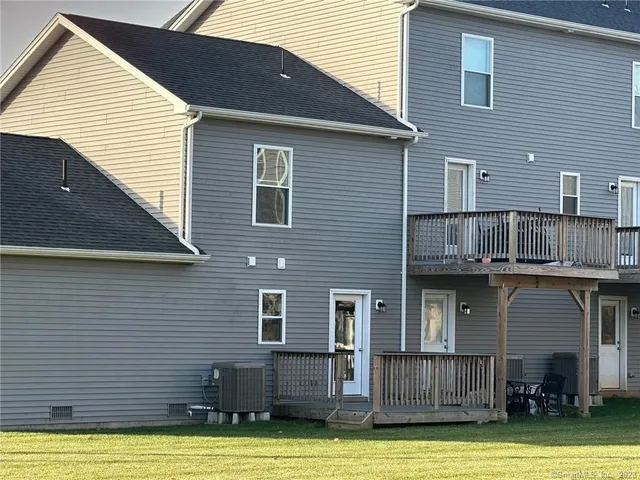 a view of a house with wooden deck