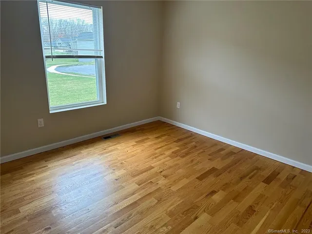 an empty room with window