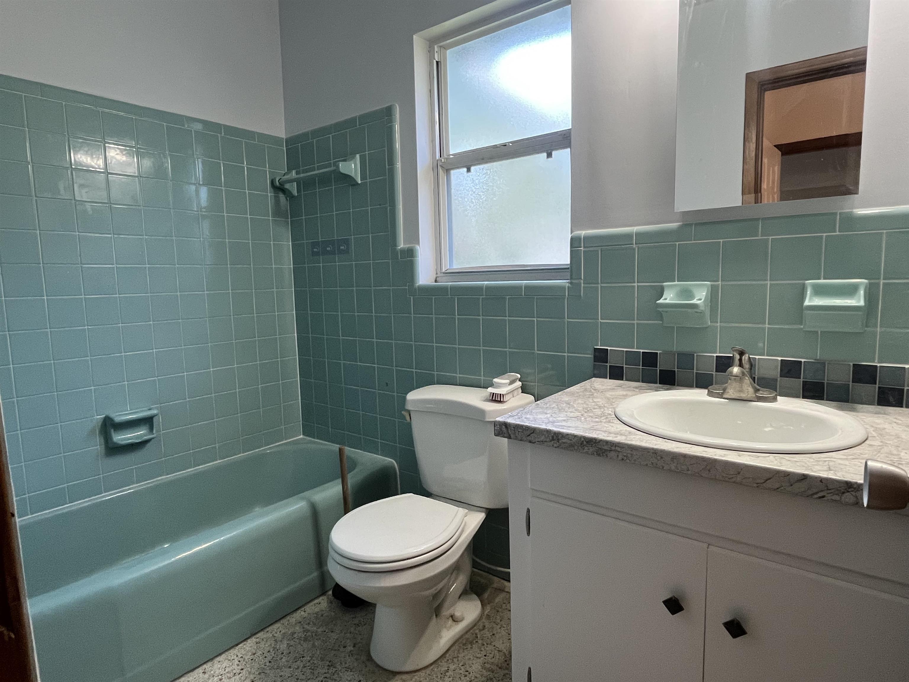 58 Riberia Street St. Augustine, FL 32084 - Photo 12 of 20 a bathroom with a sink toilet and shower