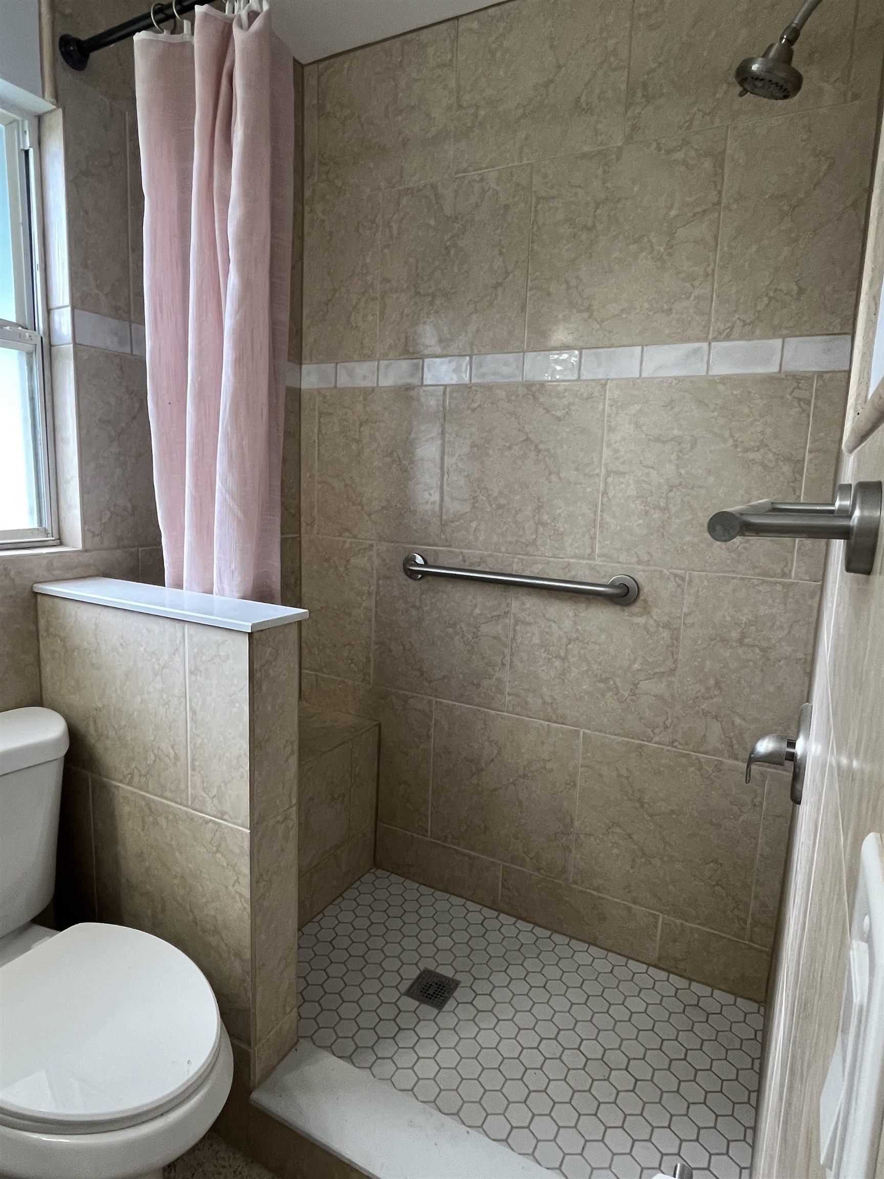 58 Riberia Street St. Augustine, FL 32084 - Photo 15 of 20 a white toilet sitting next to a shower