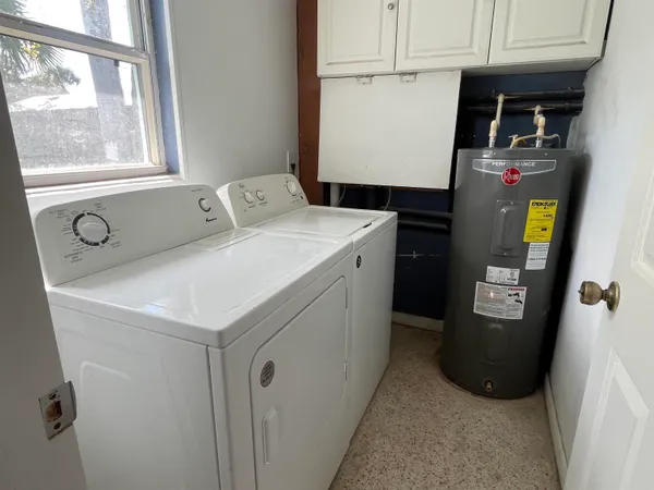 a utility room with washer and dryer