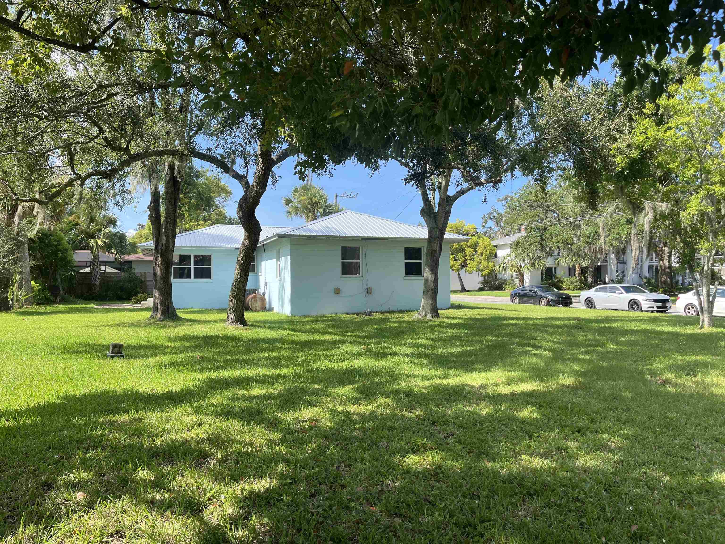 58 Riberia Street St. Augustine, FL 32084 - Photo 2 of 20 a front view of a house with a garden
