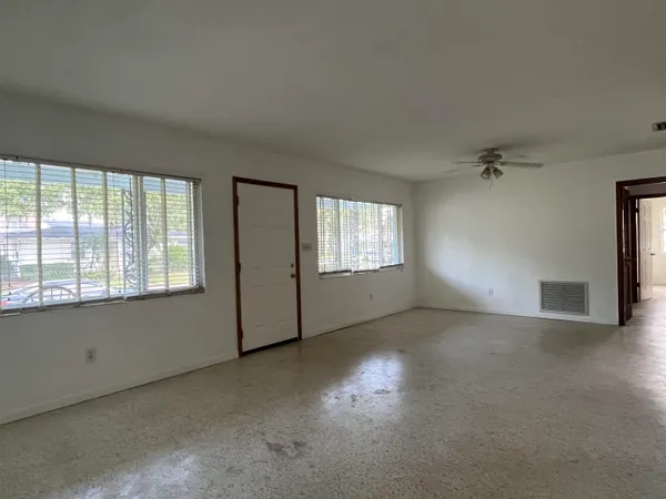 a view of an empty room with a window