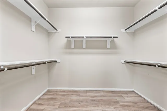 a view of an empty walk in closet