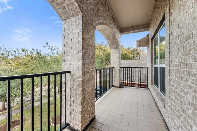 a view of a balcony with wooden floor