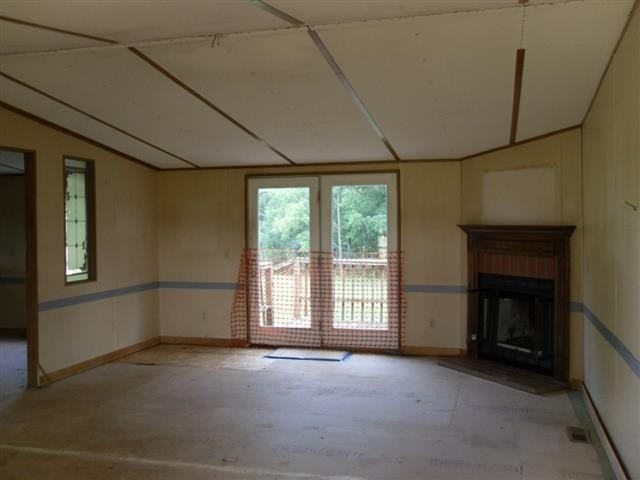 328 Seed Tick Road Sweetwater, TN 37874 - Photo 2 of 12 a view of empty room with a fireplace