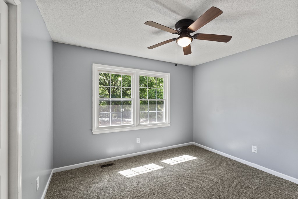 104 Doyle Drive Seneca, SC 29678 - Photo 7 of 19 This airy bedroom offers ample natural light and a comfortable, tranquil ambiance.