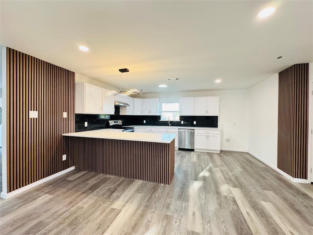 106 Hillcrest Street Mansfield, TX 76063 - Photo 11 of 26 a kitchen with kitchen island granite countertop a sink and cabinets