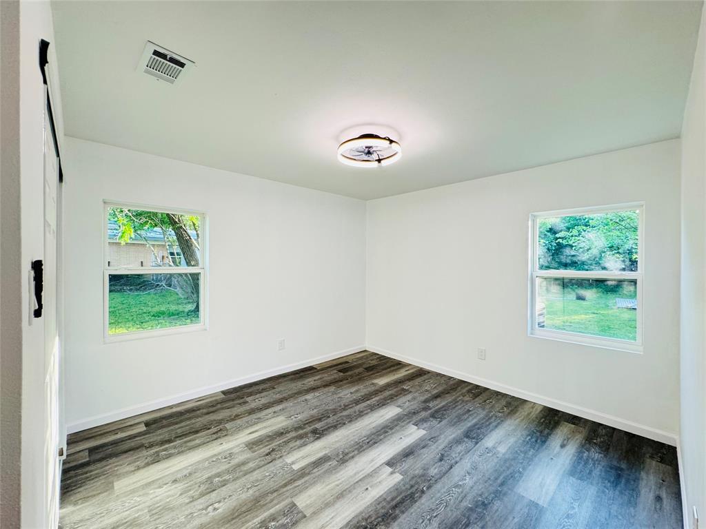 106 Hillcrest Street Mansfield, TX 76063 - Photo 18 of 26 an empty room with a window