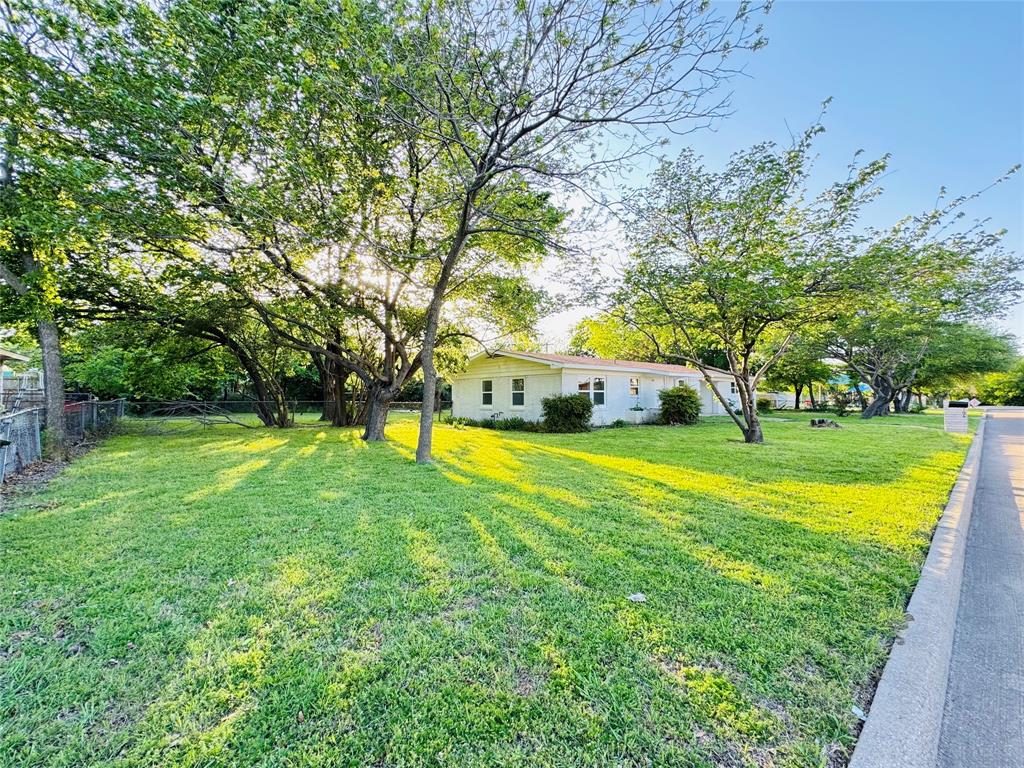 106 Hillcrest Street Mansfield, TX 76063 - Photo 2 of 26 a view of swimming pool with large trees and a big yard